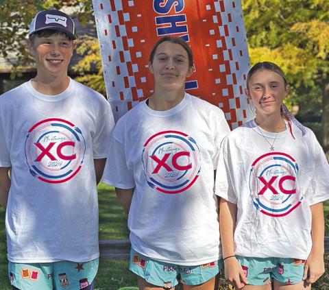 Photo by Amy Schmidt Luke Laws, Ashlyn Dehning, and Kynsleigh Krebs all represented the G-R Mustangs at State XC on October 25.