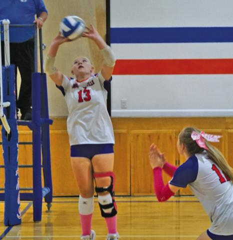 Photo by Michele Heck Sophomore Mikaylee Campbell sets to senior Taleigh Starr during the Western Trails Conference Tournament on Saturday, September 20.