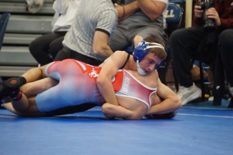 (Photo by Michele Heck) Freshman Kray Otte works his opponent during the O’Neill Invite. Otte would finish in second place in the 106 bracket.
