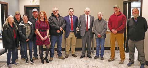 Photo by Scott Bidroski Many of the key players to the successful process to add a new building to The First National Bank of Gordon stopped for a photo during the Open House on Wednesday, December 18. Those pictured include: (L-R) Vinnie Puckett, Randy Puckett, Tess Puckett, Rusty Puckett, Courtney Johnson, John Reed, Cornelius Ray, Will Isham, Glen Spaugh, Chad Kratovil, and Kim Rosane. Not pictured: Nick Burns.
