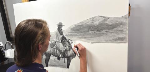 (Photo by Lisa Hare) Her latest piece, depicting a western woman on horseback in the Sandhills, is meant to be a “restful image,” according to the artist.