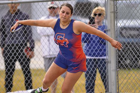 (Photo by Morgan Meisenheimer) Junior McKaley Grover winds up before launching her first place throw in the Discus. Grover was one of three Mustangs who earned a gold at the Binfield Invitational on Friday, March 28.