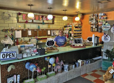 Photo by Scott Bidroski New Piece O Cake owner Caydence Bailey offers fresh baked donuts each morning, in addition to the cakes, floral and gifts.