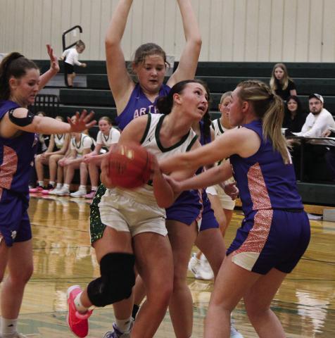 (Photo by Jessica Mintken) Senior Mya Turman pushes through the Arthur County defense in the 59-32 Hawks win on Saturday, December 6.