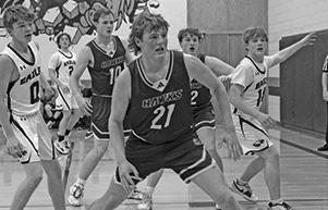 Photo by Jessica Mintken Junior Talan Smith defends against the Garden County Eagles. Smith would led the Hawk offense in this one, pouring in 18 points.