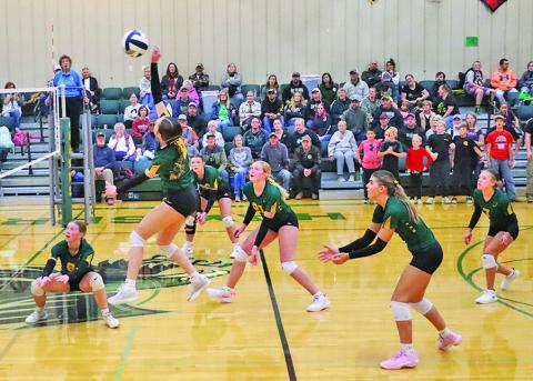 (Photo by Scott Bidroski) Junior Kya Binger puts a big swing on offense while her teammates remain at the ready during the Sub-District Final match against Crawford. The Hay Springs Hawks would get the win in this one but fell short to Bruning-Davenport/Shickley in the District Final on November 1.