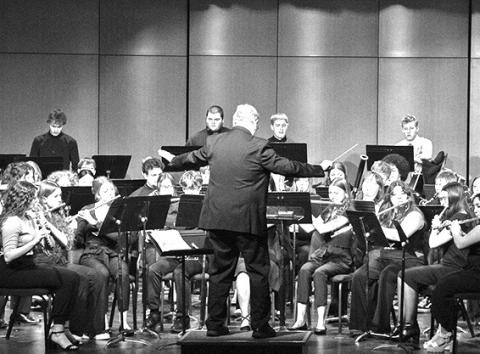 Photo by Tena L. Cook, Chadron State College High Plains Band and Choir Festival Guest Conductor Dr. Frank Tracz, Professor of Music and Director of Bands at Kansas State University, leads the Honor Band in its final performance Feb. 6, 2024, in Memorial Hall’s Auditorium.