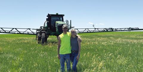(Photo by Lisa Hare) Marc and Halley Sandberg of Hay Springs work their farm together, utilizing John Deere’s GreenStar Technology for much of the management for their operation.