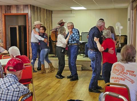 Courtesy Photo Several couples take advantage of the country music being played at Rushville’s Senior Center Kitchen Concert on June 29.