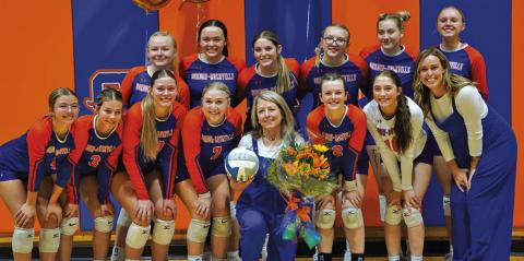 Photo by Michele Heck The Gordon-Rushville Volleyball team presented Coach Kim Campbell flowers and a signed volleyball to celebrate her 500th win as a volleyball coach. Coach Campbell became the 35th coach in Nebraska High School Volleyball history to win 500 matches with her win over Ainsworth on Thursday, September 17. Read the full story on Page 7!
