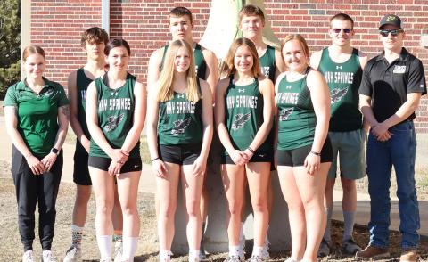The 2024 Hay Springs Hawks Track &amp; Field team. Pictured: (L-R) Head Coach Frankie Johnson, Parker Wellnitz, Adrianna Hafner, Reese Varvel, Dylan Raymer, Alaina Raymer, Gage Mintken, Josie Kelly, Mason Albrecht, and Assistant Coach Charles Twarling. Photo by Scott Bidroski