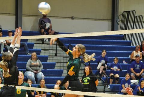 Photo by Michele Heck Junior Julia Russell fires a shot against Crawford at the G-R Quad on Saturday, September 14. The Hawks would win the match against the Rams 2-0.