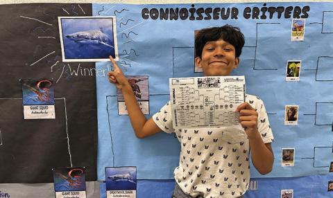 Photo by Amy Schmidt Joel Montenez-Rodriguez shows off his winning bracket for March Mammal Madness at Gordon-Rushville Middle School.