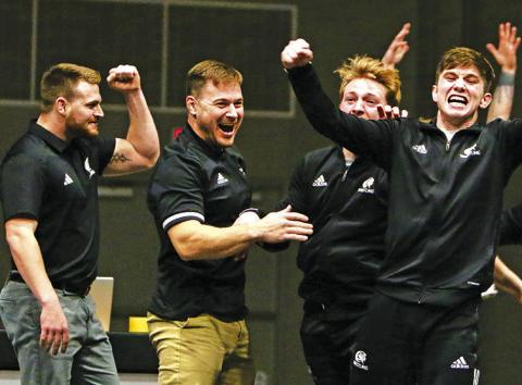 Courtesy Photo Chadron State Wrestling Head Coach Brett Hunter and the Eagles celebrate after winning a dual against Adams State that clinched a share of the Rocky Mountain Athletic Conference title. The Eagles went 8-0 in conference duals on way to winning the conference title.
