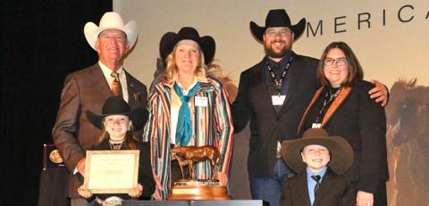 Courtesy Photo BOXO Quarter Horses, which is based in central Sheridan County, was named the AQHA 2023 Top Money-Earning Ranching Heritage Breeder of the Year. Included in the photo are: (LR) 2023 AQHA President Ken Banks, Tenley Ostrander, Jecca Ostrander, Stetson Ostrander, Courtney Ostrander, and Jensen Ostrander. Not pictured: Cash Ostrander