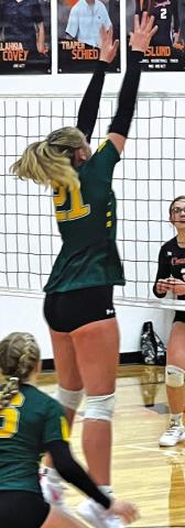 Courtesy Photo Freshman Devyn Young goes up for the block against C-K.