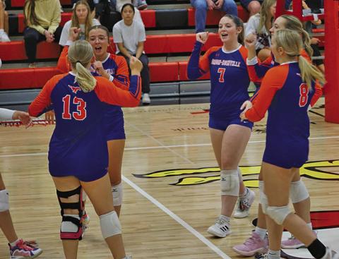 Photo by Michele Heck The Mustangs celebrate an ace during the match against Chadron on Thursday, September 4.