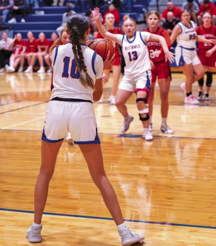 (Photo by Richae Malara) Junior Rarity Cournoyer (#10) lines up the three point attempt while sophomore Mikaylee Campbell works for position in the paint. Cournoyer led the Mustangs in scoring this week with 26 points in the two games.
