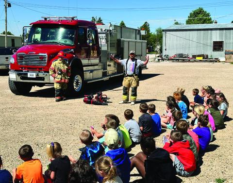 Photo by Scott Bidroski The students at the STEAM program in Rushville getting a safety demonstration from the Rushville Fire Department.