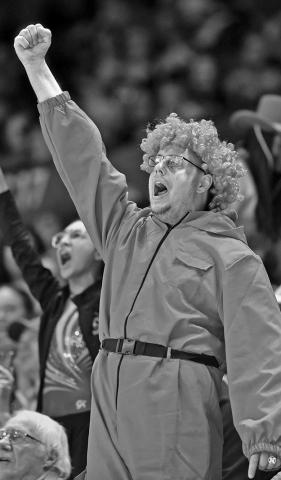 Photo by Eric Gregory for the Flatwater Free Press Kevin Coleman cheers on the Husker women gymnastics team as they host Michigan at the Devaney Sports Center on Jan. 27, 2024.