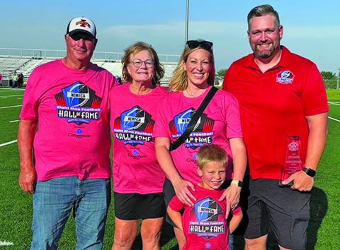 Courtesy Photo Jeff, Ronna, Abbey, Wells, and Brandon Johnson on the field in Hastings after his Eight Man Football Hall of Fame induction.