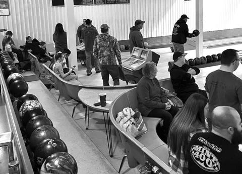 Courtesy Photo Community members come together to support the CARE Bowling Fundraiser.