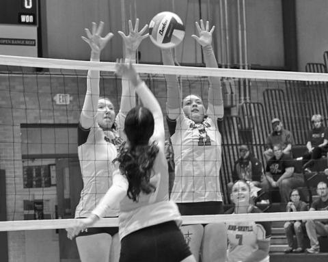 Photo by Michele Heck Junior Stormy Tesch and senior Taleigh Starr go up for the block against Valentine on Thursday, October 9. The Badgers would get the win though, 3-0.