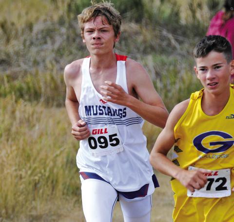 Photo by Chris Heiser Sophomore Draegon Leonard digs deep in the 5K race at Chadron State College on Friday, September 13.