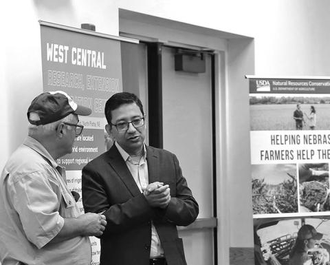 Photo by Nicole Heldt Bijesh Maharjan, right, Nebraska Extension soil nutrient and management specialist, speaks to an attendee at the second Soil Health School at the West Central Research Extension and Education Center in North Platte.