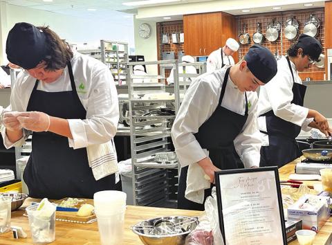 Photo by Kay Kruger Gordon-Rushville ProStart team Tres Leches works tediously on their dish for the State Final Three competition in Omaha, Neb. on March 15. Pictured are team members Seth Mills, Tristin Costello, and Juan Montenez-Rodriguez.