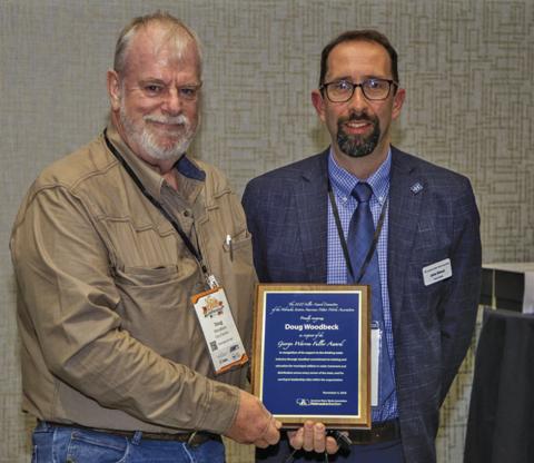 (Courtesy Photo) Gordon resident and City Council member Doug Woodbeck receives the George Warren Fuller Award from AWWA Vice-President John Eisnor, who came from Halifax, Nova Scotia to visit the conference.