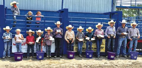Photo by Courtney Ostrander The participants lined up following all the events during the 2024 Junior Rodeo to show off the hardware they earned in the arena. Those pictured include: (L-R) Myah Burress, Brookley Peters, Connor Peters, Weston Rahn, CoBurn Morrison, Payton Burress, Shaylee Grant, Truett Kearns, Tru Mundorf, Audrabell Werth, Sutten Parkison, Matthew Lein, and Bentley Ford.