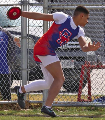 (Photo by Scott Bidroski) Sophomore Braylon Holston spins ahead of firing the discus for his personal best mark and first place finish at the Binfield Invite on Friday, March 27.