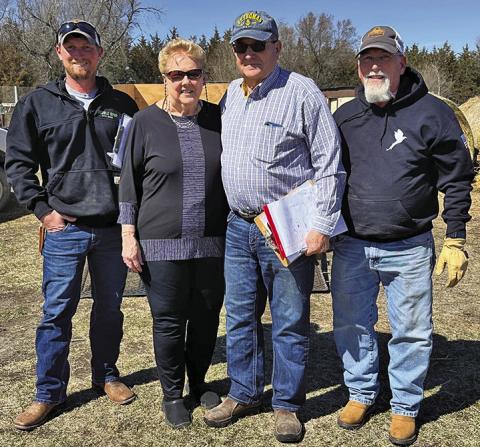(Photo by Heidi Beguin) Zane Baldwin, Carol Nickolisen, Gary Ruse, and Jim Baldwin pause for a photo as pheasants were being delivered to their new homes.