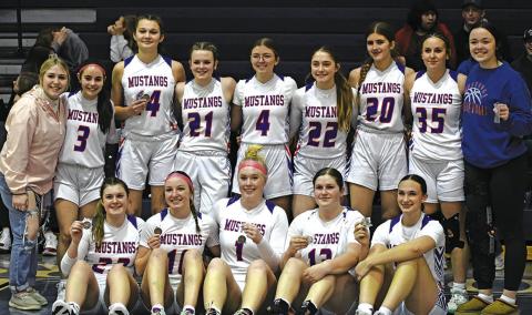Photo by Melissa Grover The Gordon-Rushville Girls Basketball team poses for a team photo with their third place medals following the win over Morrill to clinch that finish.
