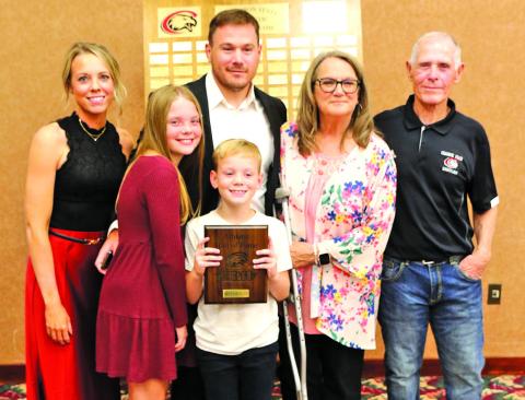 Photo by Con Marshall Brett Hunter is shown with his wife, Ashley, their children, Paisley and Jax, and his parents, Roger and Elizabeth, on Saturday, October 5, when he was inducted into the Chadron State Athletic Hall of Fame.