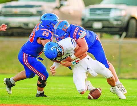 Photo by Morgan Meisenheimer Senior Maddox Leeper lowers the boom on O’Neill QB Turner Heiss. Leeper would get the sack and the forced fumble for his efforts on this play.