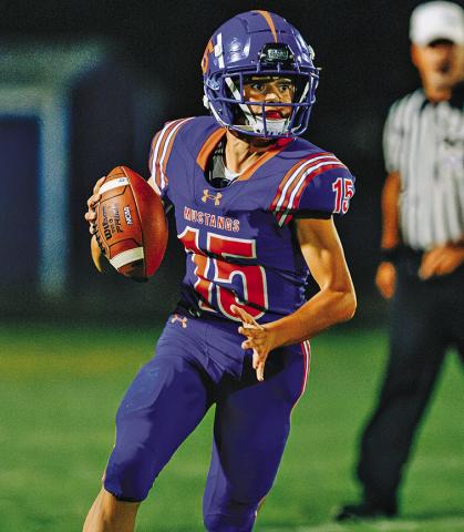 Photo by Morgan Meisenheimer Freshman Khai Janssen found junior Kannon Leeper for the only Mustang score in their loss to O’Neill on Sept. 5.