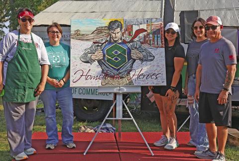 (Courtesy Photo) Members of the Security First Bank staff accepted this one of a kind painting done by local artist, Autumn Mangione. Those included in the photo are: (L-R) Sherry Erman, Amanda Haller, Morgan Weyers, Melissa Jancik, and Dave Galyen.