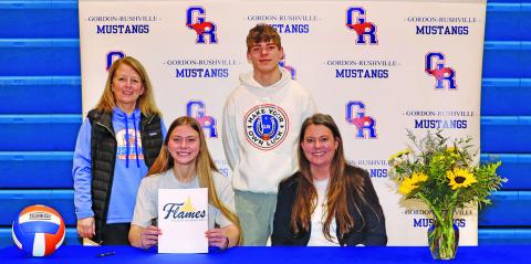 Photo by Scott Bidroski Gordon-Rushville senior Emma Martins signed her letter of intent to play collegiate volleyball at the College of St. Mary’s on Tuesday, March 11. Martins is joined by Gordon-Rushville Volleyball Coach Kim Campbell, her brother Daniel Martins, and mother Ashley Martins in the photo.