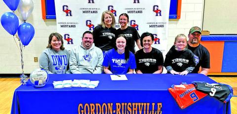 (Photo by Scott Bidroski) Gordon-Rushville High School senior Rowan Simonson made her collegiate sporting dreams come true this past week by signing her letter of intent to play volleyball at Dakota Wesleyan University. Simonson put ink to paper with her family and friends on Tuesday, December 16. Those pictured include (L-R) Kori Simonson, Nic Simonson, Rowan Simonson, Brooke Simmons, Sutton Simmons, and Justin Simmons. In the back row is Head GRHS Volleyball Coach Kim Campbell and Reese Simonson.