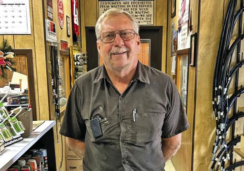 (Photo by Scott Bidroski) Rex Retzlaff was chosen as the 2025 Sheridan County Fair &amp; Rodeo Good Neighbor. Retzlaff, pictured here at his job at Frontier Service and Supply in Rushville, was recognized for his many years of dedication to his community.