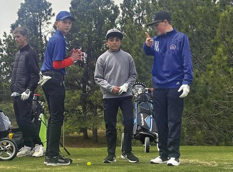 Photo by David Morris This trio of Mustangs (Roffers, Hunter, Jackson) discuss some strategy while waiting to tee off during the Western Trails Conference Invite in Kimball, Neb.