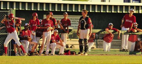 Photo by Megan Heiting The Security First Regulators look on from the dugout during a contest at Modisett Ball Park during the 2024 season.
