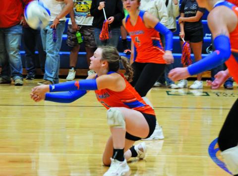 Photo by Michele Heck Senior Braylynne McKimmey gets down for the dig against Chadron. McKimmey finished the match with 16 digs.