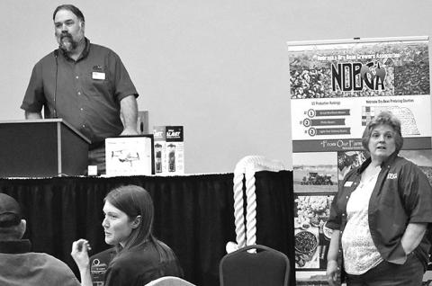 Courtesy Photo NDBGA President Dan Hinman, left, does raffle with help from Lesli Howell, NDBGA office manager/Bean Bag editor.