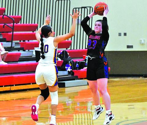 Photo by Melissa Grover Senior Lillee Schmidt looks for the pass over the defense of the Bridgeport Bulldogs.
