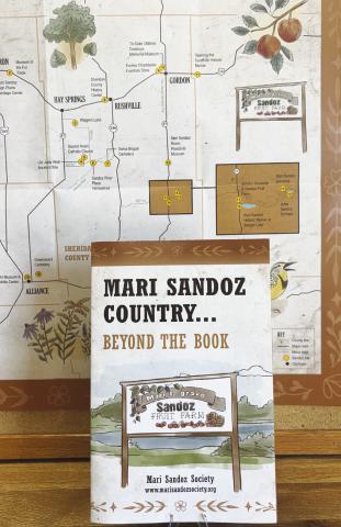 (Photo by Lisa Hare) New maps produced by the Mari Sandoz Society are modeled after the original “circle tour” maps designed in the 1970s, but with a modern twist. The new Sandoz Country tour map includes all the original locations, plus newer sites such as the High Plains Heritage Center in Chadron. (Copies of the map are available at the Sheridan Country Journal Star office.)