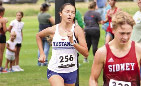 (Photo by Scott Bidroski) As cool as the other side of the pillow. Junior Rarity Cournoyer outpaced the competition during the Panhandle Classic, finishing in first place and setting a new school record with a time of 19:21.