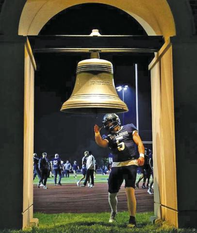 (Photo by Ben Meyer) Concordia University senior and 2022 Hay Springs High School graduate Logan DeCoste rings the bell in celebration of a home football game victory in Seward, Neb. DeCoste is entering his fourth and final season as a Bulldog football student-athlete.